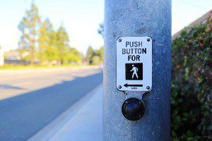 pedestrian crossing at busy intersection