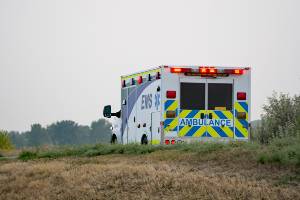 ambulance departing a crash scene - daylight