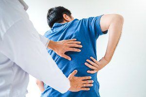 doctor treating back injury