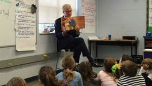 Greg Monforton reading to students