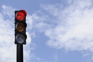 driver runs a red light and causes an accident