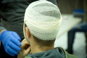 head wrapped in bandages