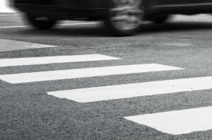 car driving through crosswalk